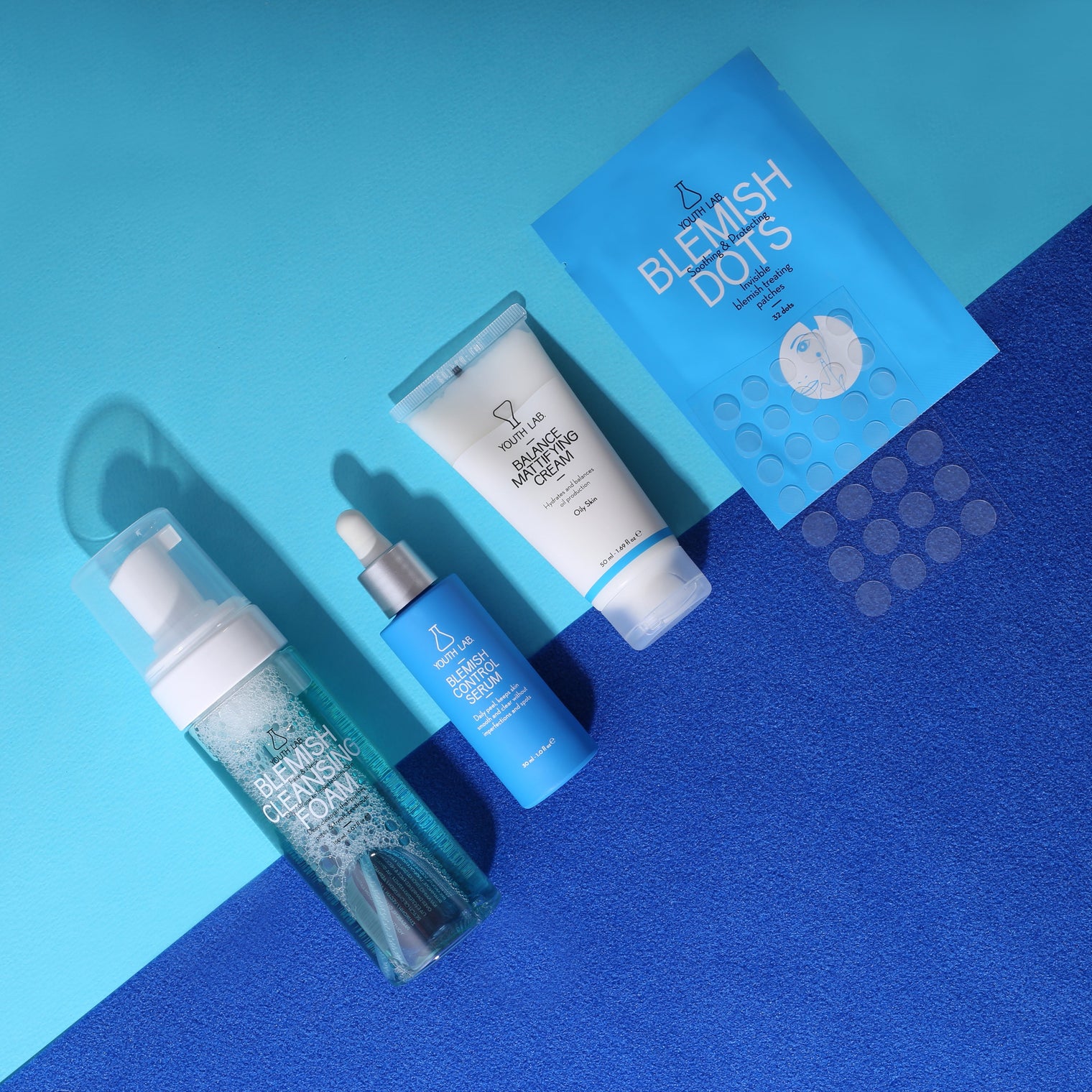 Oil-control face cream being applied to skin, formulated to reduce shine, tighten pores, and calm blemishes