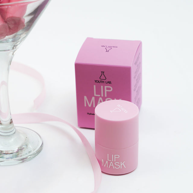 Pink lip mask container and packaging on a white background