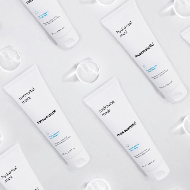 Multiple bottles of mesoestetic hydravital mask on a light gray background