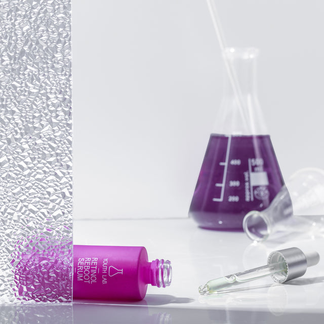 Anti-aging serum dropper targeting wrinkles, acne, and skin tone with retinol and marine actives”