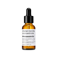 Bottle of melan tran3x concentrate by mesoestetic on a white background