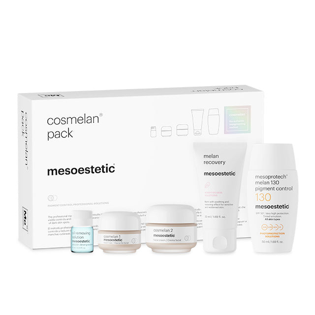 Mesoestetic cosmetic products including a box and various bottles on a white background