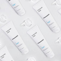 Multiple bottles of mesoestetic hydravital mask on a light gray background